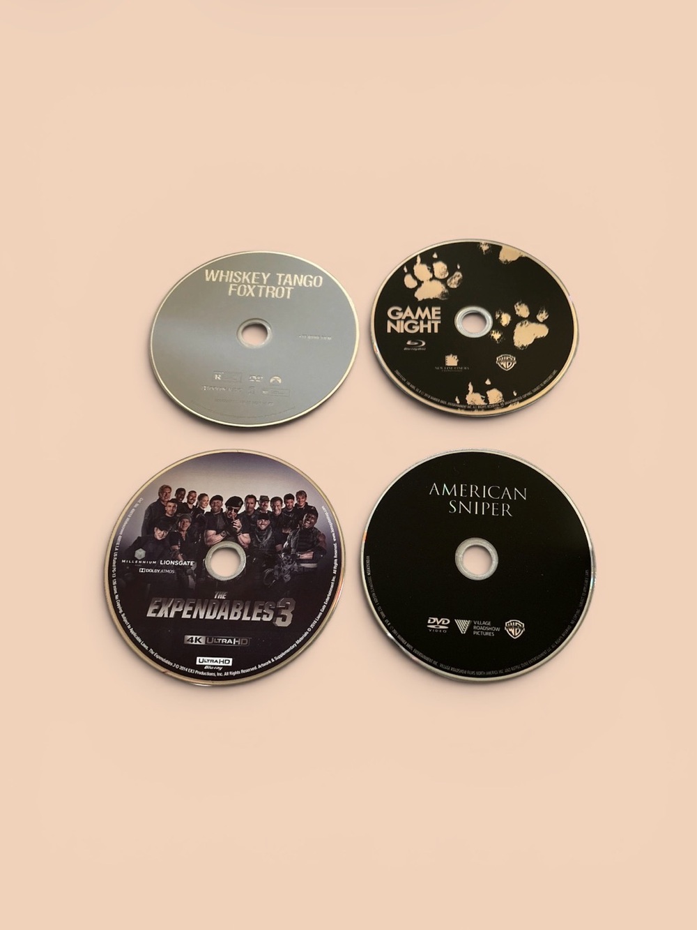 Set of Four Black and Silver Movie Discs — Mixed Titles
